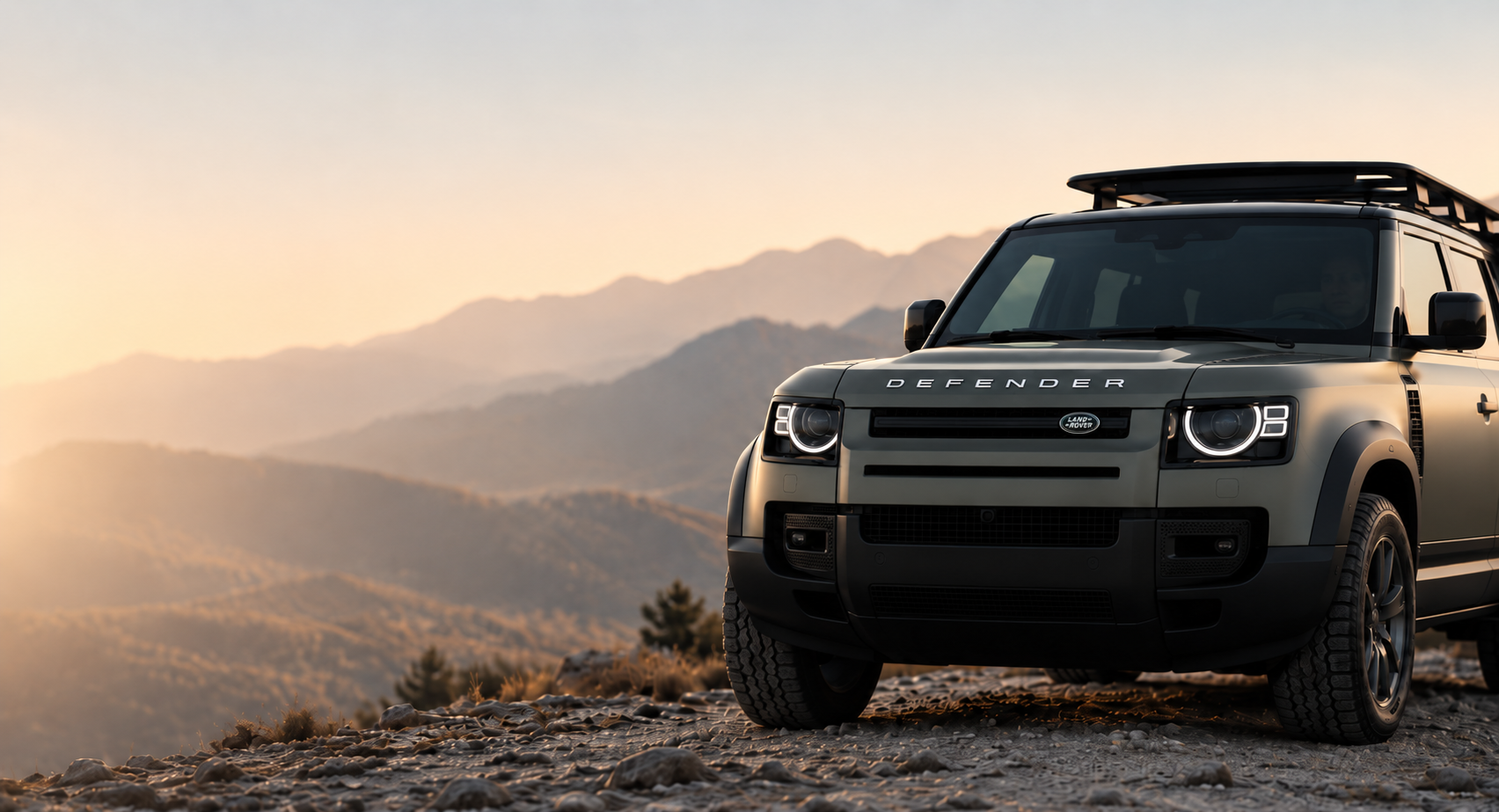 Land Rover Defender overlooking the mountains